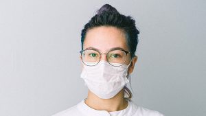 Person wearing face mask and glasses